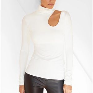 European jersey fitted unique cut turtleneck.